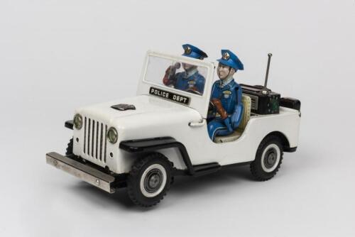 JEEP: A 1960s Japanese battery operated tin toy of a Police Jeep by T.N. Nomura
