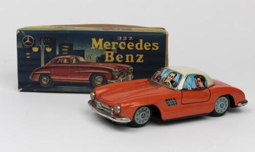 MERCEDES: A 1950s Japanese friction operated tin toy of a Mercedes Benz Gullwing 300 SL 2-door coupe by Bandai