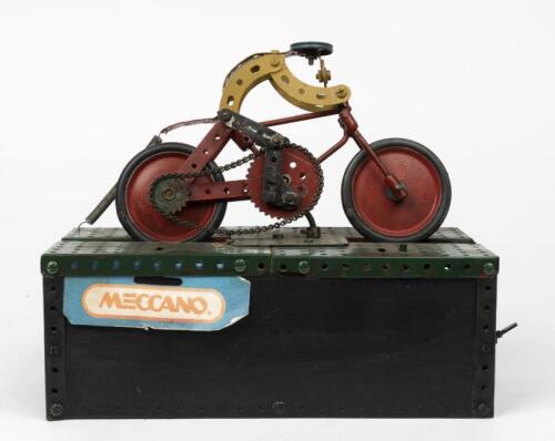 MECCANO: A Meccano motorcycle on powered stand, circa 1950's