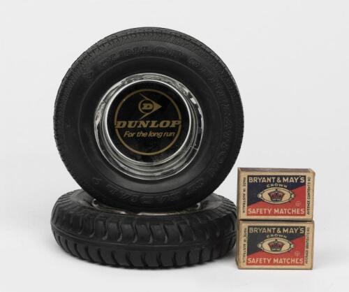 DUNLOP: Two promotional ashtrays in the form of a tyre with glass insert 16cm diameter, together with two original boxes of Bryant and May matches.