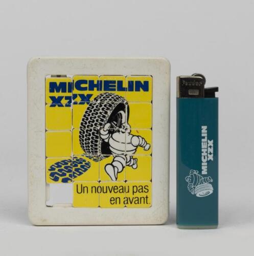 MICHELIN: A Bibendum slide puzzle and a French Bibendum lighter by Feudor