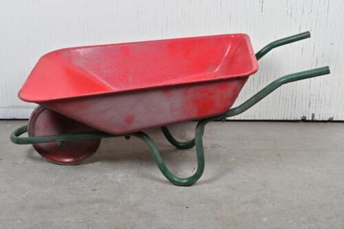 CHILDS WHEELBARROW: A 1950s red metal wheelbarrow