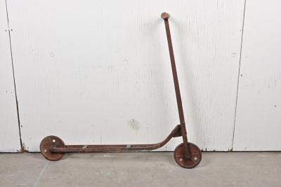 SCOOTER: A circa 1940s rustic metal child's scooter