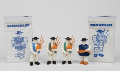MICHELIN: A collection of four musical Bibendum figures, circa 1980s