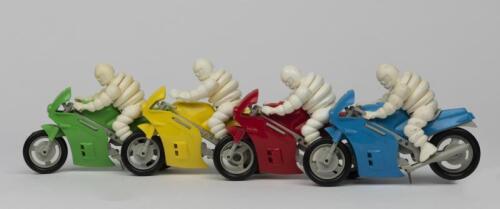 MICHELIN: A set of four Bibendum figures on motorbikes, circa 1980s