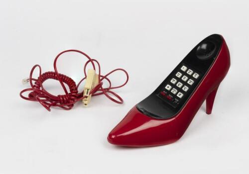 TELEPHONES: An Owner Tooling Columbia Telecom red stiletto form telephone, 1987