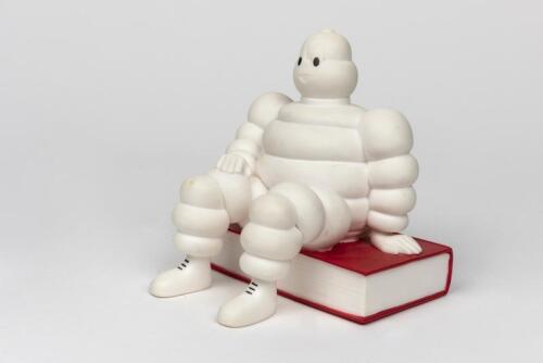 MICHELIN: A 2006 Bibendum figure on book