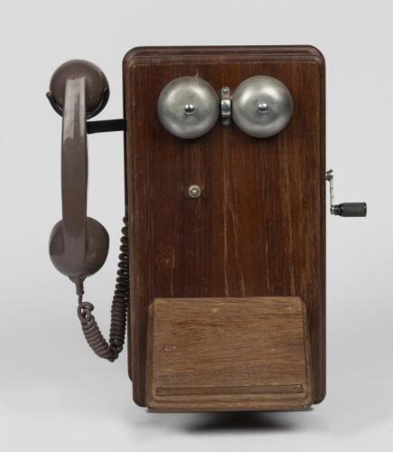 TELEPHONES: An Ericsson magneto general service oak case telephone, circa 1950