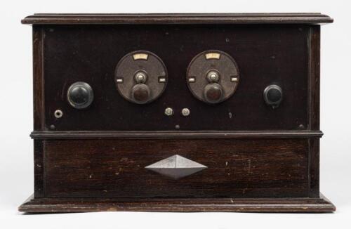 RADIO: An early 20th century four value portable wireless radio
in hardwood case