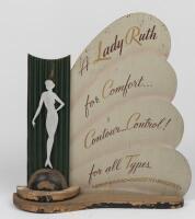 SHOP DISPLAY: An Art Deco point of sale display sign "Lady Ruth Contour Control Corset", circa 1930