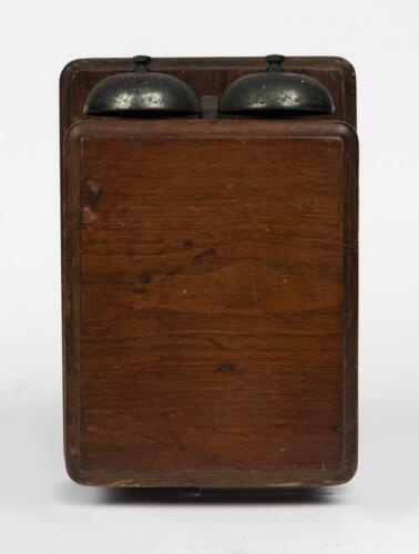 TELEPHONES: An oak case wall mounted ringer box, early 20th century