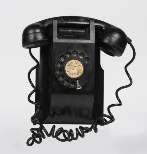 TELEPHONES: An AWA black Bakelite wall mounted rotary telephone, late 1950's