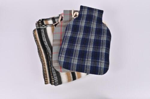 WARMERS: A stripped wool blanket and two hot water bottle with fabric covers by Anne Mannion of Blackthorn Textiles, Yea Victoria