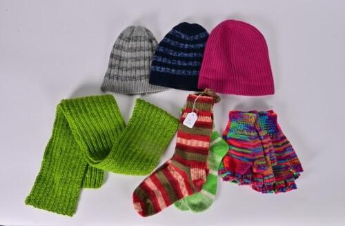 WARMERS: A collection of unworn woollen winter clothes including a hand knitted scarf, pair pairs of socks and two pairs of fingerless gloves , together with three beanies