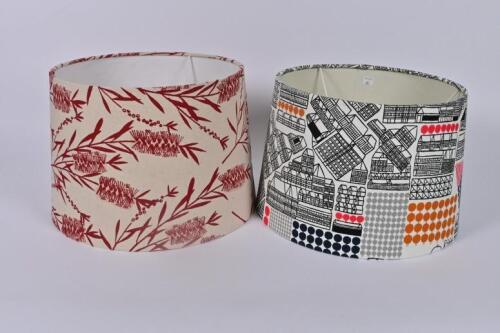 LAMPSHADES: A printed cotton and a printed linen lampshade by Anne Mannion of blackthorn textiles,&nbsp;26cm high, 39cm diameter