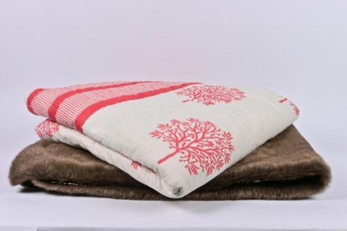 THROWS: A faux fur and leopard print throw and a red printed cotton throw