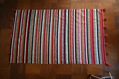 RUGS: A large Indigenous soft wool rug<br />with multicolour strips with tassels<br />268 x 150cm