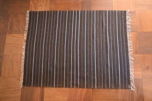 RUGS: A handwoven Navajo brown ground wool rug, Grand Canyon region, USA circa 1980<br />slightly faded to one side<br />174 x 138cm
