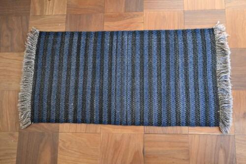 RUGS: A handwoven Navajo blue and black stripped wool rug, Grand Canyon region, USA circa 1980<br />175 x 89cm