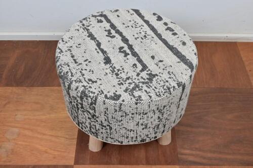 STOOL: A contemporary stool with fitted wool cover on wooden base, 46cm high, 38cm diameter