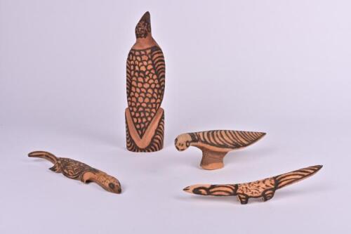 INDIGENOUS ARTIFACTS: A collection of carved Australian animals