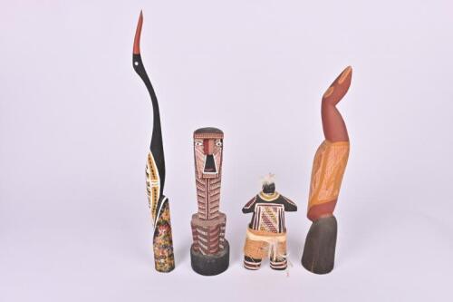 INDIGENOUS SCULPTURE: A collection of indigenous carvings including two carved and painted waterbirds, one with chip to beak of tallest being 48.5cm high