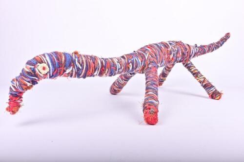 INDIGENOUS SCULPTURE: A Tjanpi Desert Weaver wool sculpture of a Goanna, Irrunytju, Western Australia, 90cm long