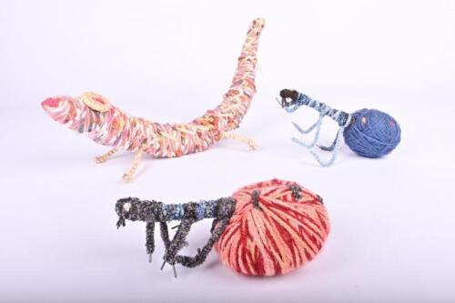 INDIGENOUS SCULPTURE: A Tjanpi Desert Weaver wool and reed sculpture of a lizard Irrunytju, Western Australia and two wool honeypot ants, 36cm long