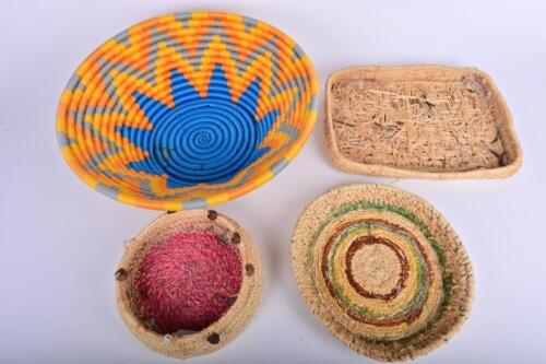BASKETS: Four hand woven baskets, the largest 47cm diameter, 15cm high