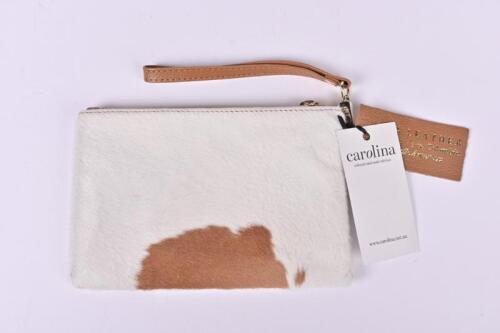CLUTCH BAG: A tan and white cowhide clutchbag by carolina, 13 x 20cm