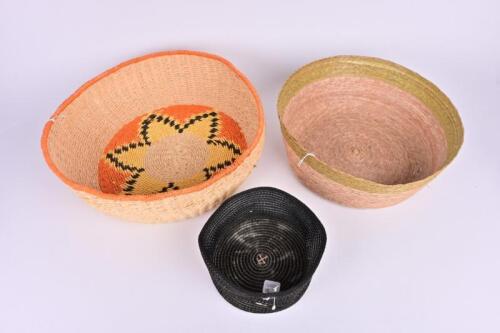 BASKETS: Three woven Indigenous baskets, the largest basket 13.5cm high, 35cm diameter