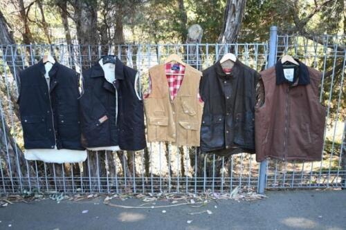 VESTS: A collection of five vests, including by RM Williams (large, waxed cotton), Driza-Bone (small, sheepskin lined), Bushcooee (small, sheepskin lined), Ralph Lauren Polo (medium, corduroy), and Thomas Cook (large, canvas)