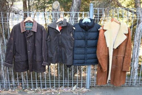 OUTERWEAR: A ladys Didgeridoonas waxed vest (small, with label), a men's Rodd and Gunn waxed jacket (small), a long sheepskin jacket with damage to shoulder (size unknown, unbranded) and a Calvin Klein black puffer jacket (medium)