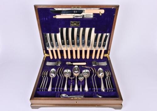 FLATWARE: A silver plate cutlery set in canteen by Viner & Hall , the knives with ivorine handles and de-lux blades, the canteen 50cm wide