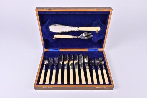 FLATWARE: A silver plate fish set in canteen , with ivorine handles, the canteen 34.5cm wide