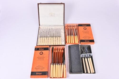 FLATWARE: A collection of fourteen vintage table and desert knives in original boxes by Friar together a boxed pair of knives and forks and a German knife set in canteen