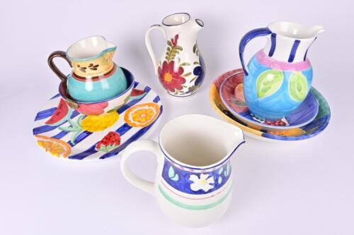 KITCHENWARE: A collection of European hand painted bowls, platters and ewers, the largest platter 36.5 diameter