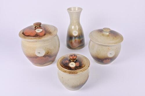 POTTERY: A graduated set of lidded jars and a vase, stamped to base: W, the largest 21cm high
