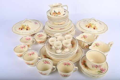 ROYAL DOULTON: A Royal Doulton 'Orchids' dinner service for 6 containing 6 dinner, side and bread plates, 6 dessert and soup bowls, 5 saucers and 6 tea cups, a milk and 2 sauce boats, plater, two lidded tureens, sugar bowl and 6 egg cups