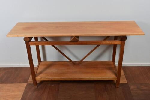 A blackwood side table by Peter Sans 55cm high x 130cm wide x 45cm deep.*(see note)