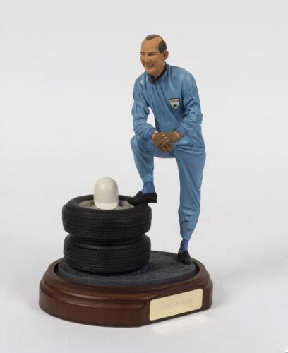 STIRLING MOSS: A 1:9 cold cast limited edition porcelain figure scale of Stirling Moss, with COA, 21cm high