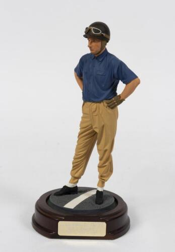 JUAN MANUEL FANGIO: A 1:9 scale cold cast limited edition porcelain figure scale of Juan Manuel Fangio, with COA, 22.5cm high