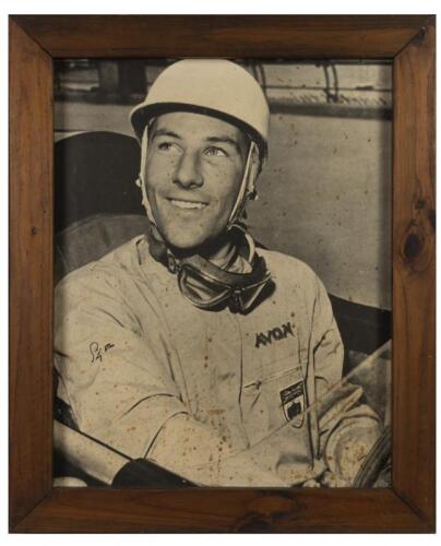 STIRLING MOSS: A large signed black and white photograph of young Stirling Moss