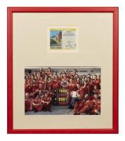 FERRARI: A signed team photograph of Scuderia Ferrari celebrating the victory at Italian Grand Prix- Monza - 2002 with an event ticket of the race