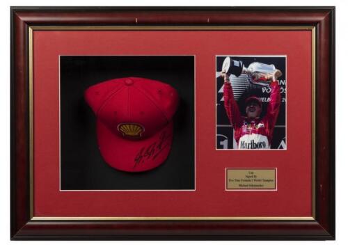 FERRARI: A signed Michael Schumacher cap with photograph