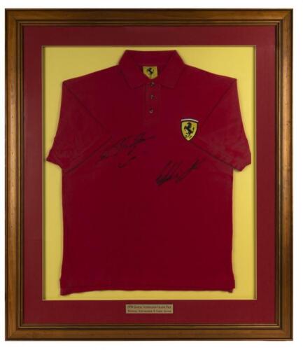 FERRARI: A framed Ferrari polo shirt signed by Michael Schumacher and Eddie Irvine from the 1999 Australian Grand Prix