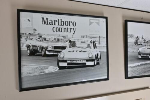 VW V8: A framed period photograph depicting Brian Thomson at the wheel of his VW V8 leading Bob Jane at Calder, inscribed on the rear