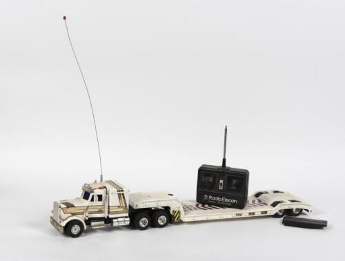 PETERBILT/THOMSON: A remote control Peterbilt low-loader truck by Shinsei. Trailer signed by Bryan Thomson