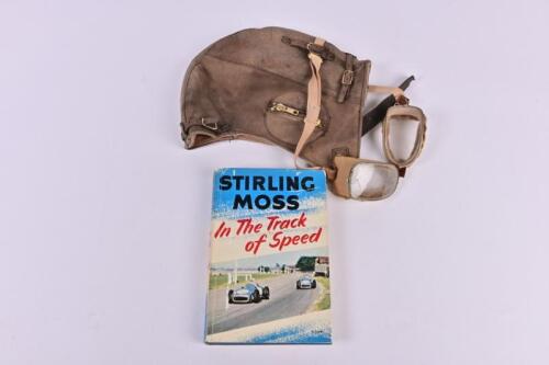 MOSS/MOTORING: Three motoring items. 'In The Track of Speed' hardcover book by Stirling Moss. With driving cap and googles