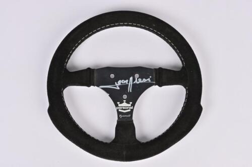 ALESI: A racing steering wheel, signed by Jean Alasi, purchased at the 1994 Adelaide Grand Prix post race pit auction
